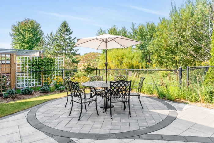 backyard interlocking patio with nice furniture to enjoy a sunny day