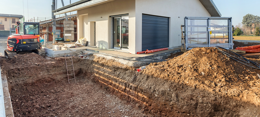 Excavation works for the installation of a swimming pool. Swimming pool under construction.