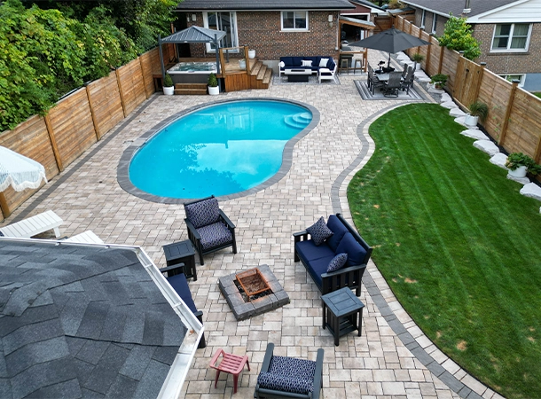 backyard space lawn, pool, interlocking work, fence, outdoor kitchen, landscaping backyard space lawn, pool, interlocking work, fence, outdoor kitchen, landscaping
