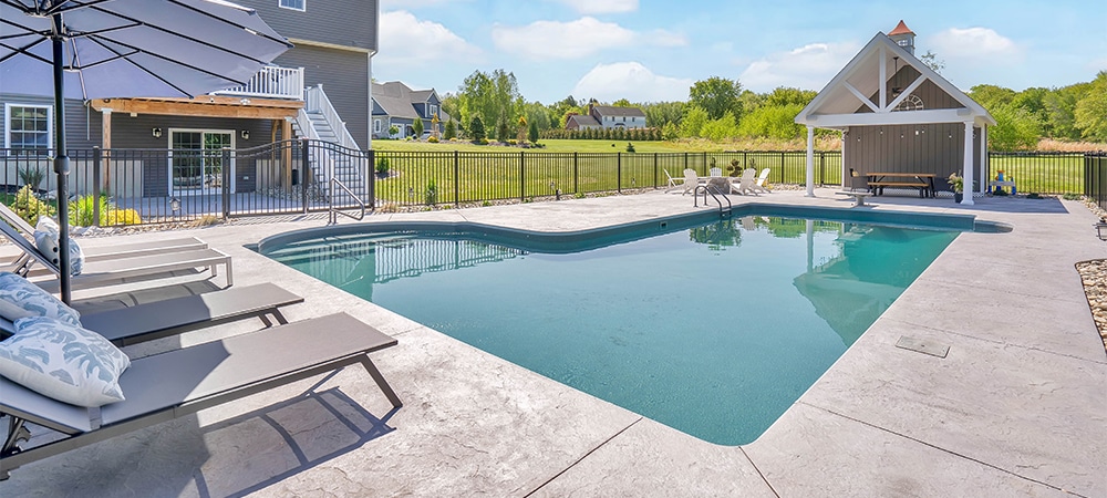 luxury private backyard with a inground pool